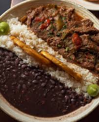 Cafe La Trova signature dishes Arroz Con Pollo
Skirt Steak Ropa Vieja
Cuban Sandwich Empanadas